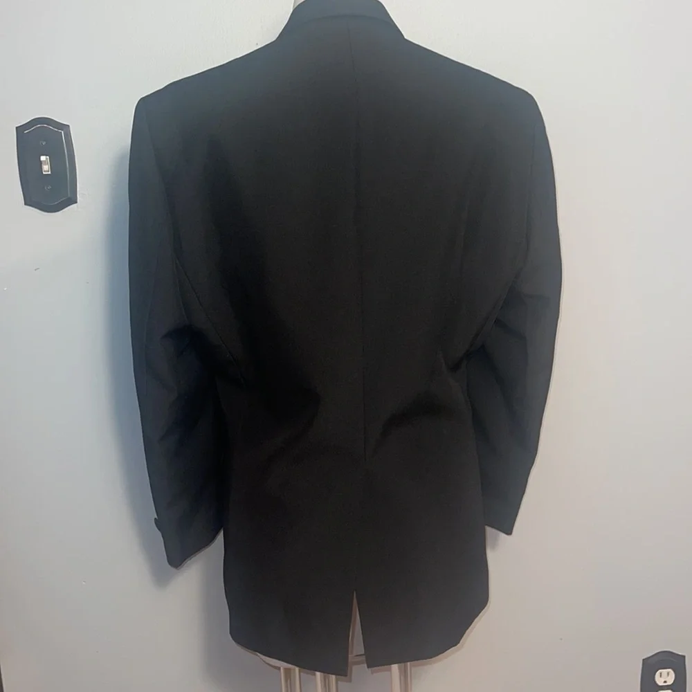 Formal Fashions men’s black tuxedo jacket and pants. Jacket 38S, Pants 34x34